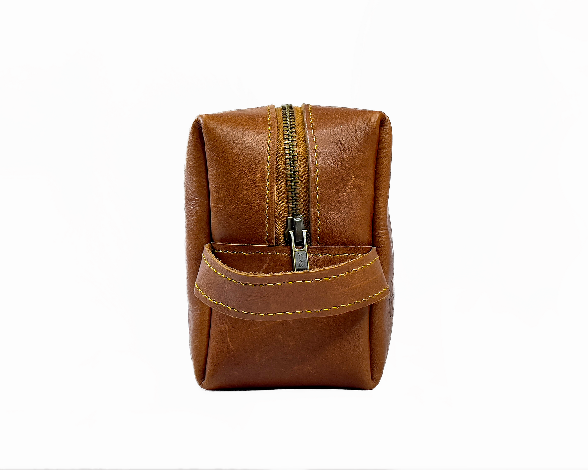 Brown leather toiletry bag on a white background