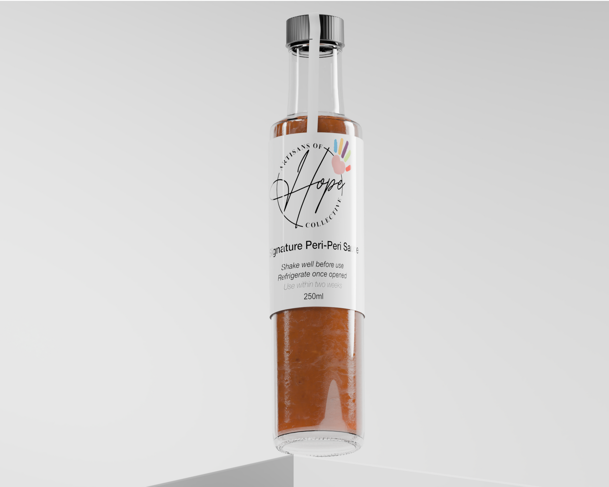 Bottle of Artisans of Hope Signature Peri-Peri Sauce on a light gray background