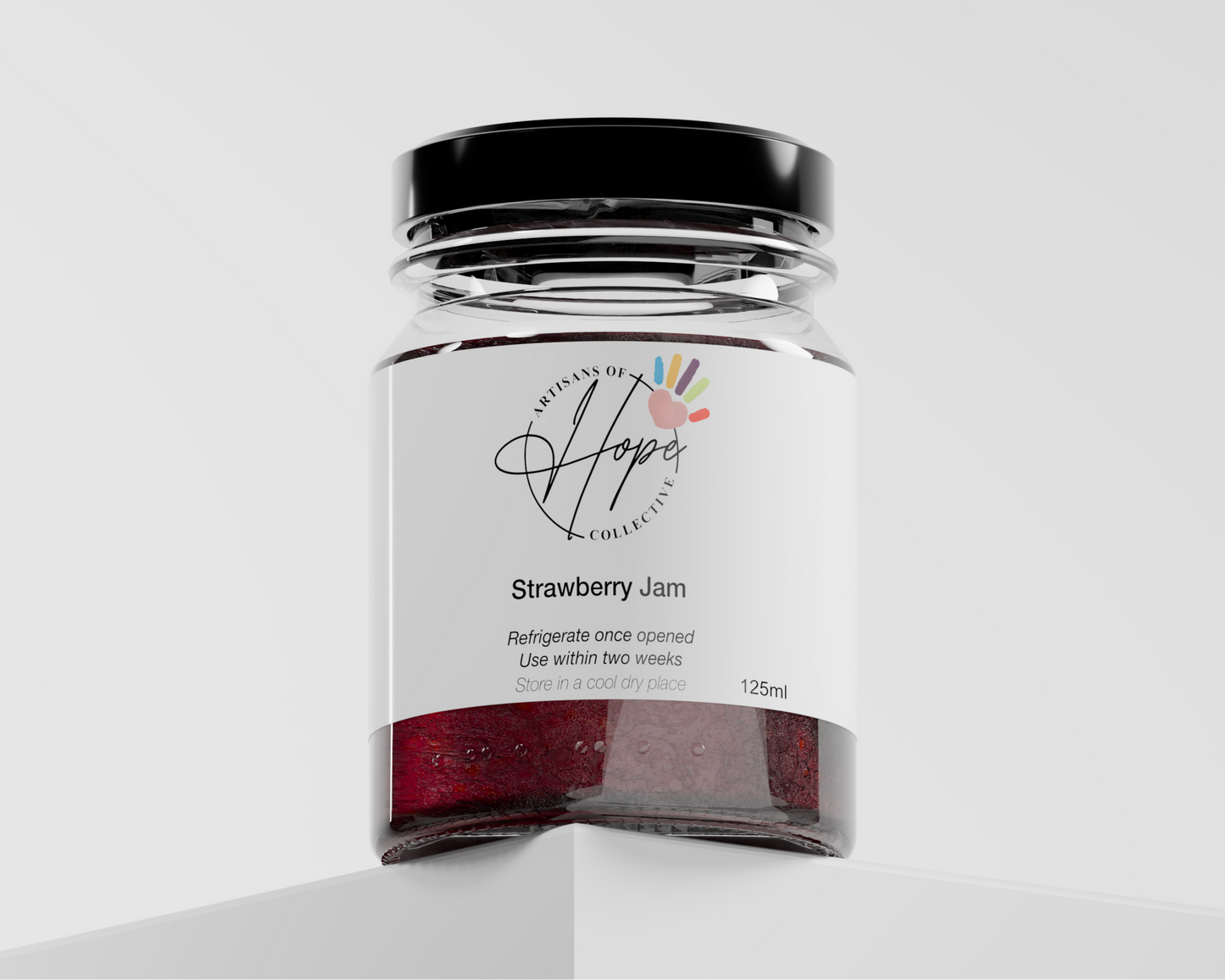 Jar of strawberry jam with a label on a white background